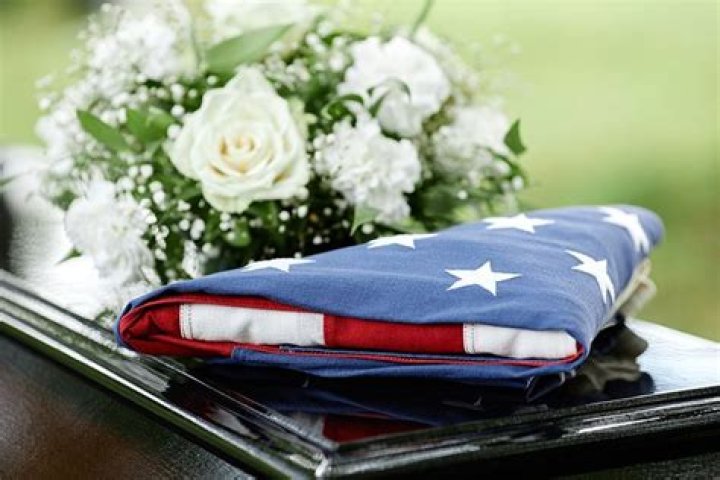 Do you put flowers on a casket with a flag