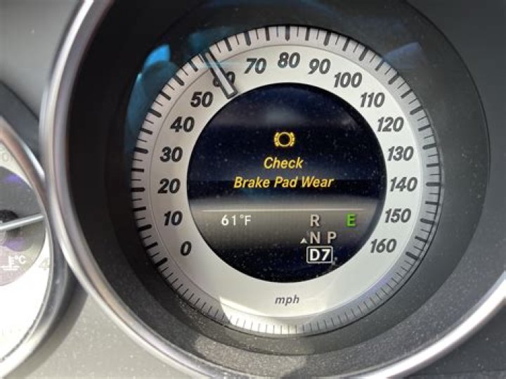 How do you turn off the brake warning light on a BMW?