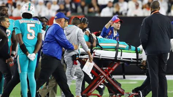 How long do football players have to stay out with a concussion?