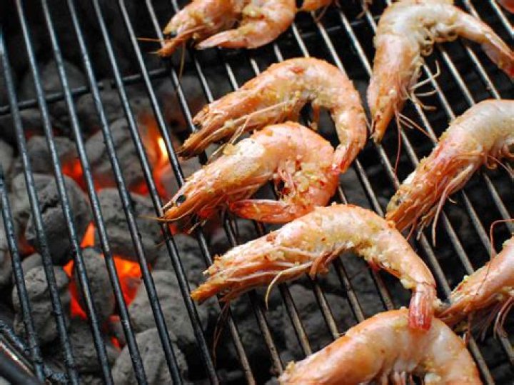 Is it better to grill shrimp with shell on or off?