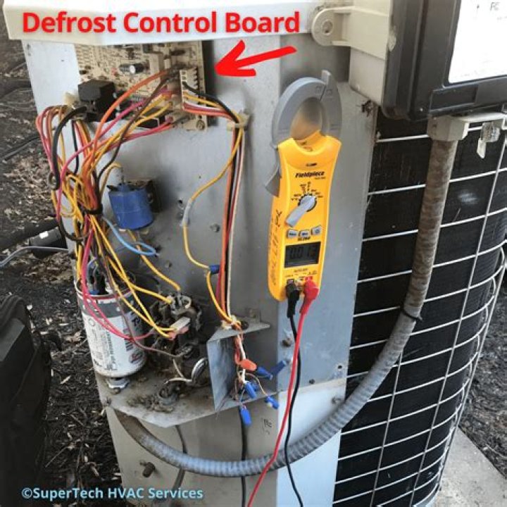 What does the adaptive defrost control board do?